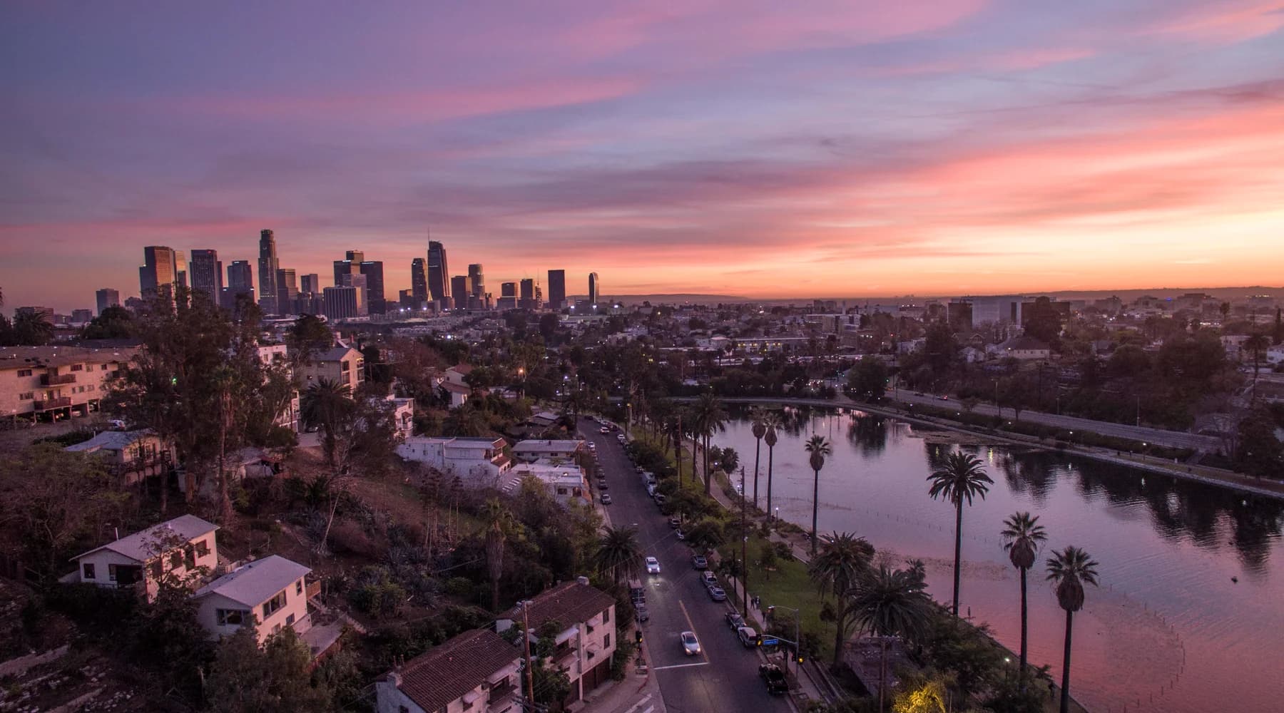 Downtown Los Angeles skyline beyond Echo Park Lake at sunset