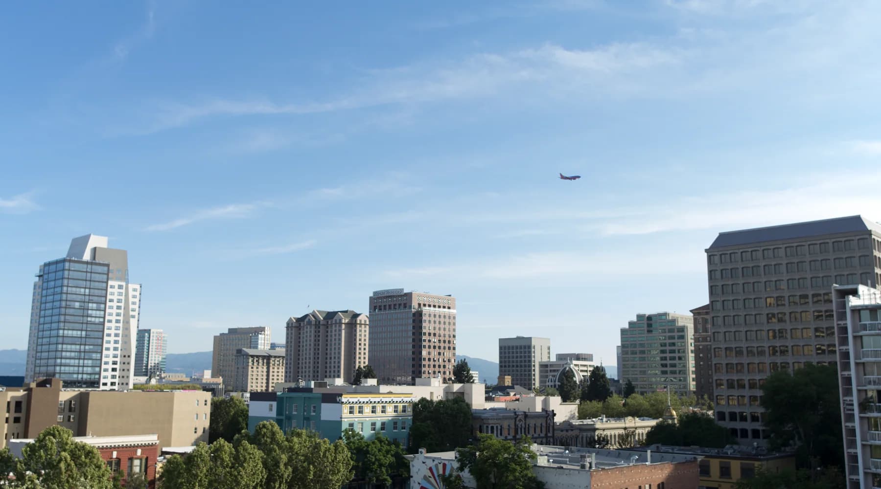 Downtown San Jose skyline above tree-lined streets